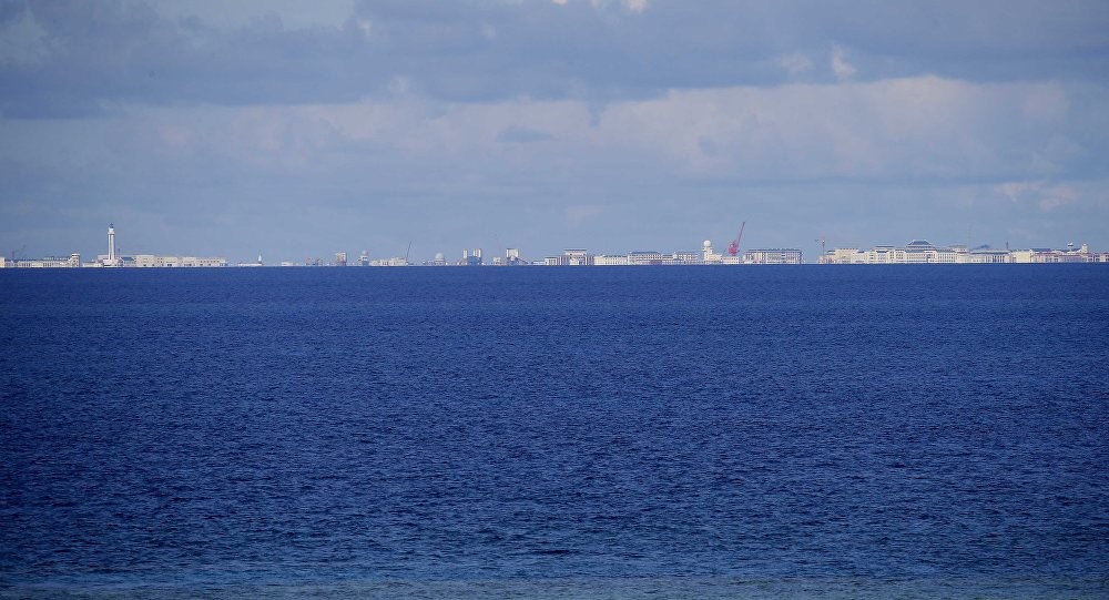 Chinese structures and buildings on the man-made Subi Reef at the Spratlys group of islands are seen 18 kilometers (11 miles) away from the Philippine-claimed Thitu Island off the disputed South China Sea